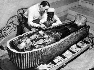 Howard Carter inspecting the mummy of Tutankhamun