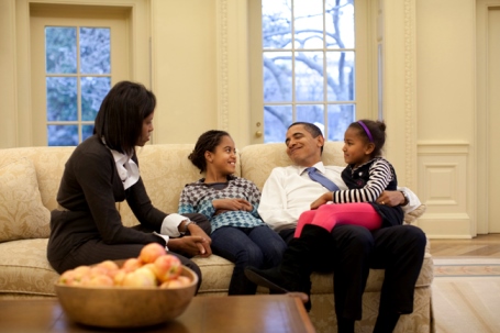 Obama family sitting on couch