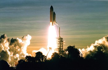 The Space Shuttle takes off from Cape Canaveral