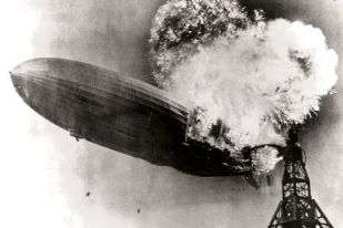 The Hindenburg airship bursts into flames