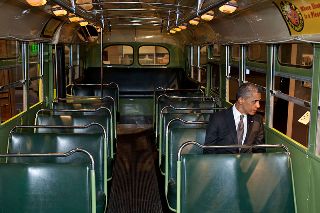 President Obama sitting on bus
