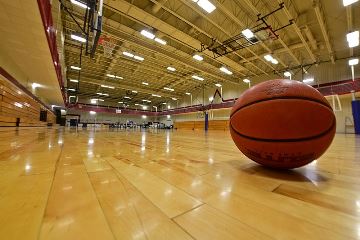 Basketball on wooden court floor